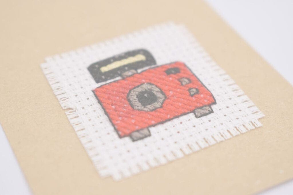 close up of embroidered Free cross stitch camera pattern
