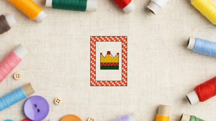 embroidered Free crown cross stitch pattern on aida fabric with threads surrounding