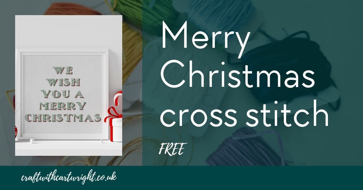 Merry Christmas cross stitch, framed in a white frame. Title image