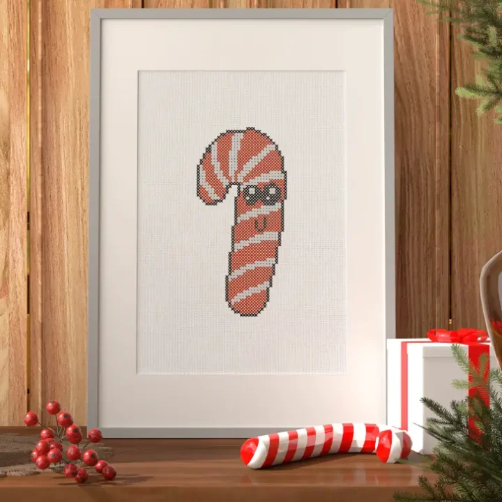 embroidered and framed candy cane cross stitch