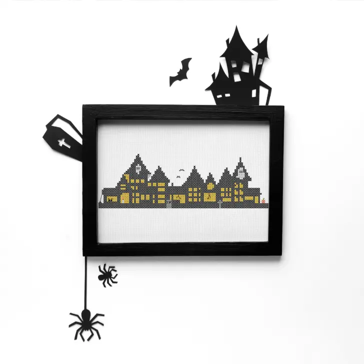 embroidered and framed Halloween tiny town cross stitch pattern