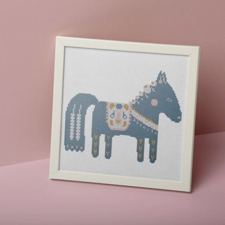 embroidered and framed dala horse cross stitch pattern