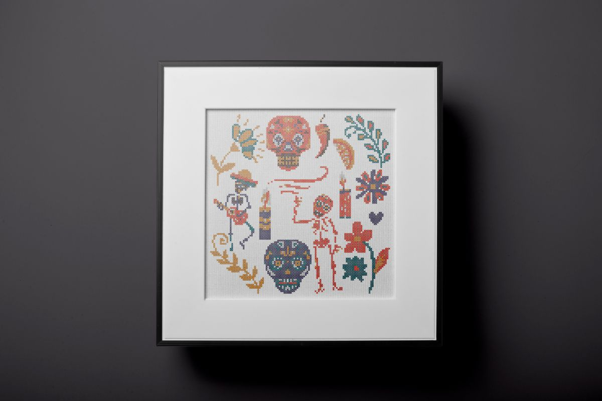 embroidered and framed day of the the dead cross stitch