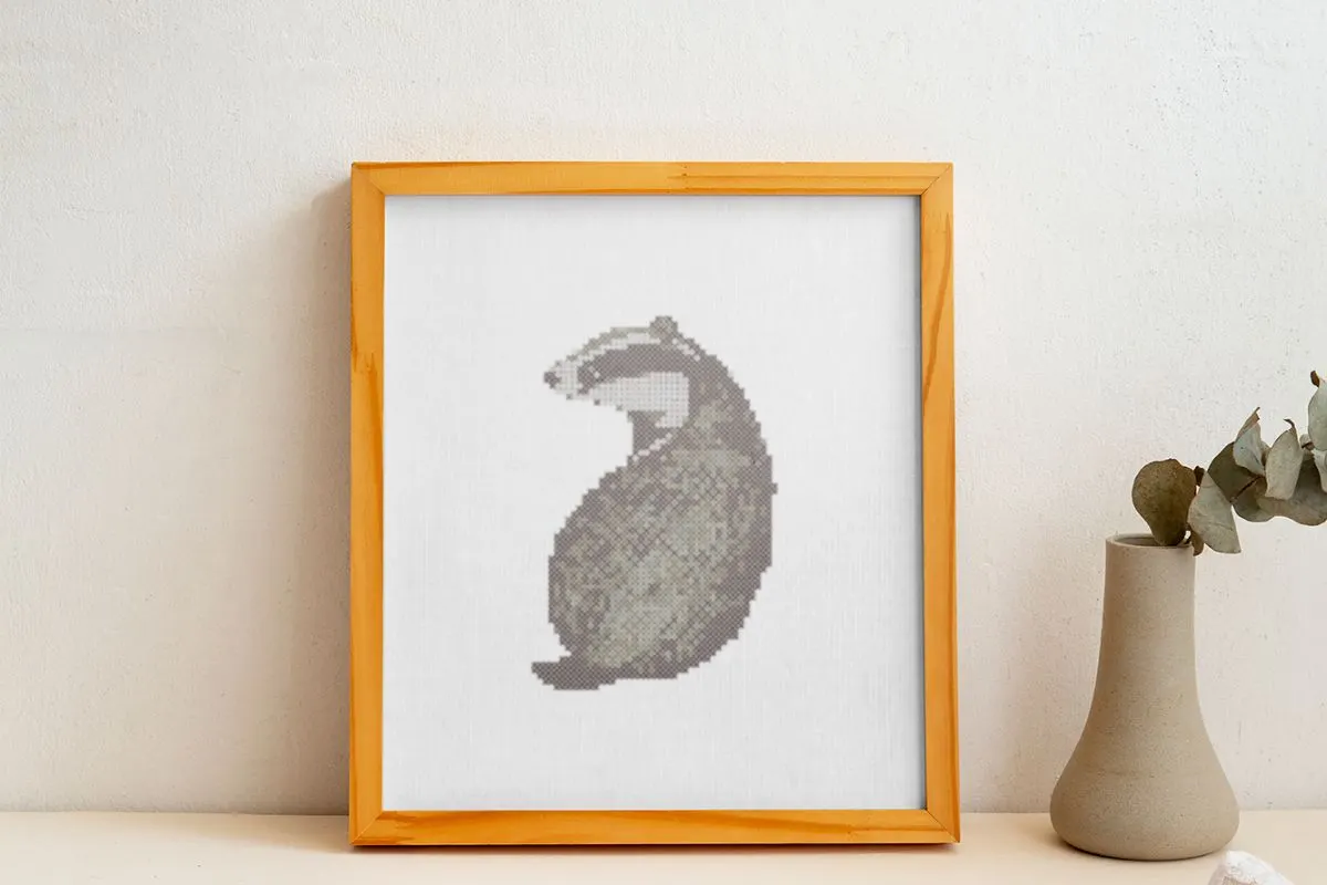 framed embroidery of a watercolour badger cross stitch pattern