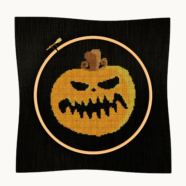 embroidered and framed pumpkin cross stitch pattern