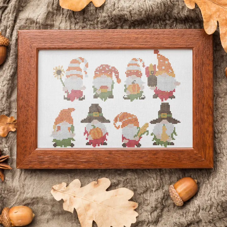 embroidered and framed thanksgiving gnomes cross stitch pattern