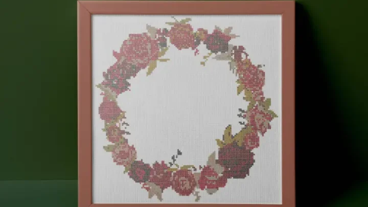 embroidered and framed christmas rose wreath cross stitch
