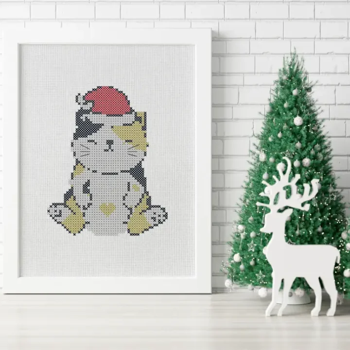 embroidered and framed christmas calico cat cross stitch