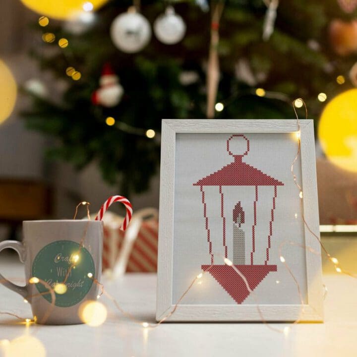 embroidered and framed christmas lantern cross stitch