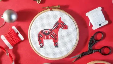 embroidered and framed christmas dala horse cross stitch