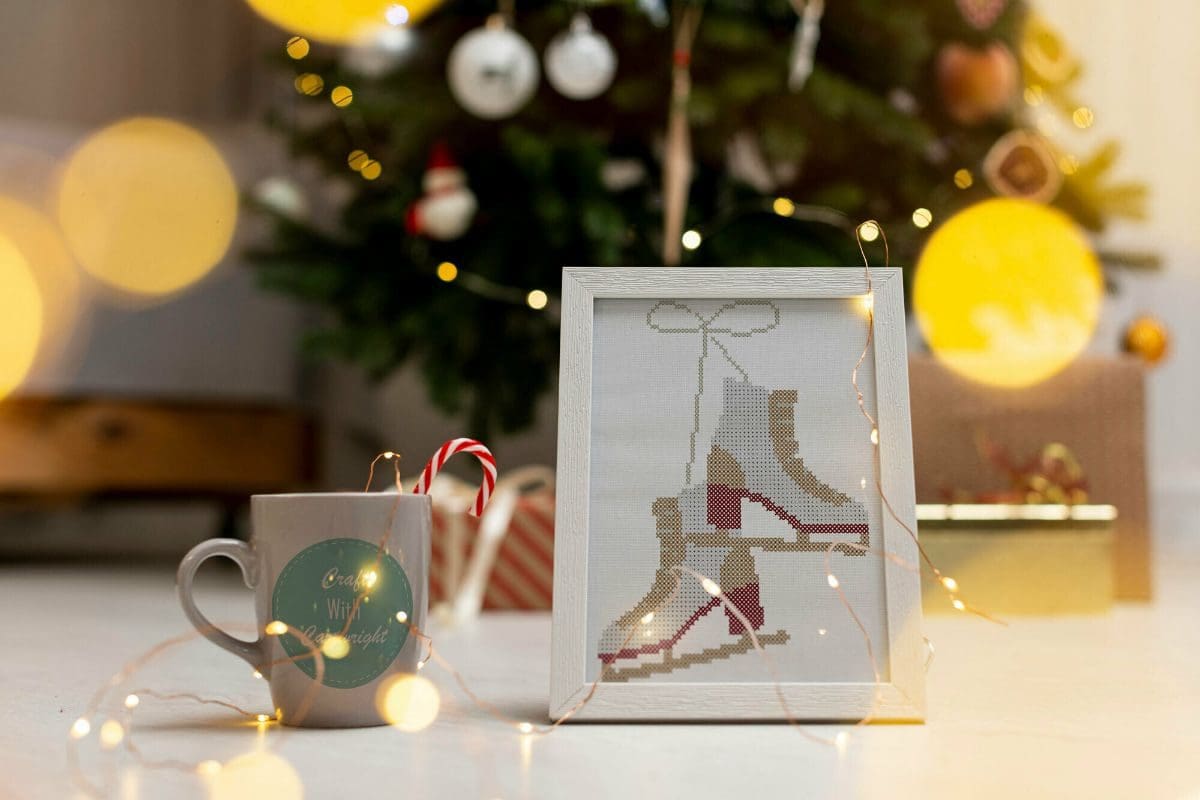 embroidered and framed ice skates cross stitch