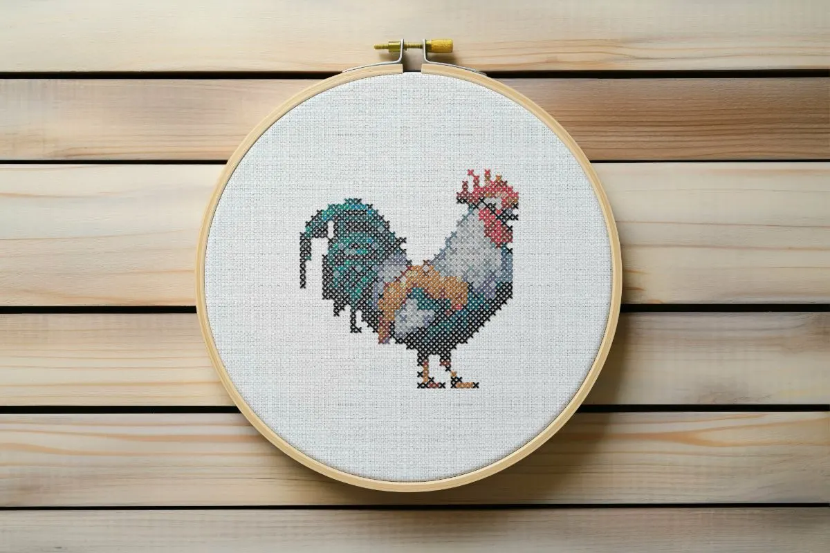 Embroidered and framed in a hoop cockerel cross stitch