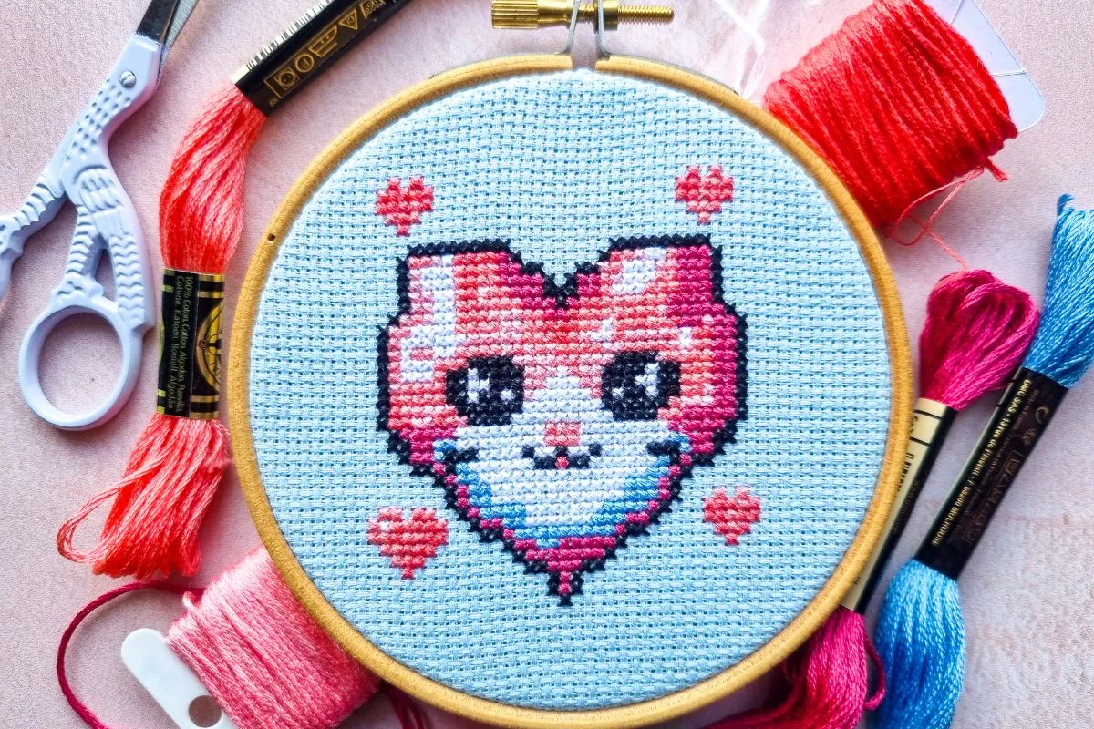 embroidered valentine kitty cross stitch framed in a hoop