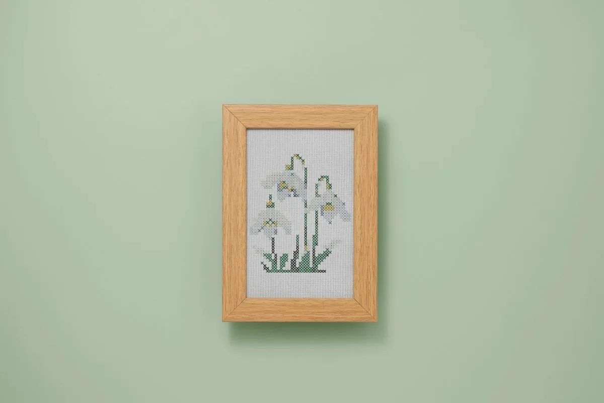 framed and embroidered cross stitch snowdrops