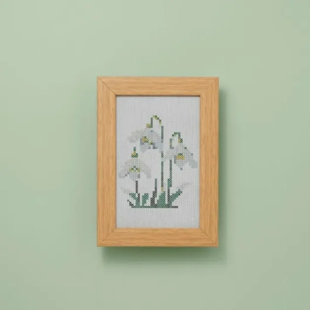 framed and embroidered cross stitch snowdrops