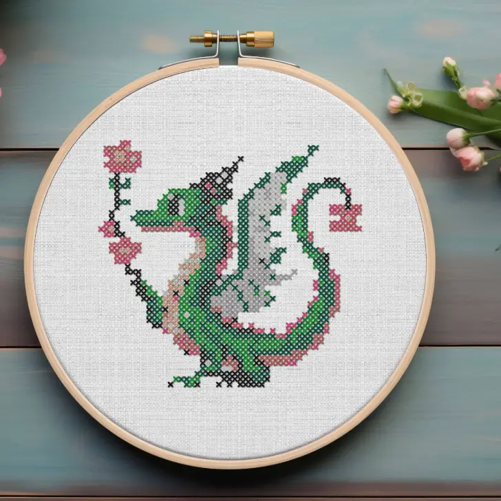 embroidered and framed in a hoop flower dragon cross stitch