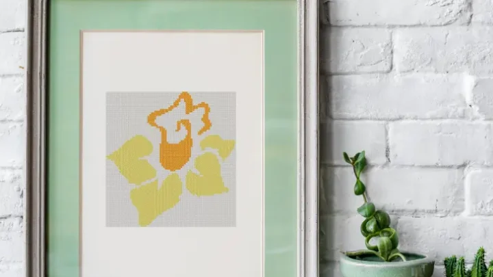 embroidered and framed daffodil cross stitch
