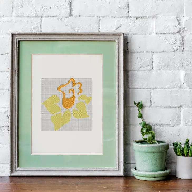 embroidered and framed daffodil cross stitch