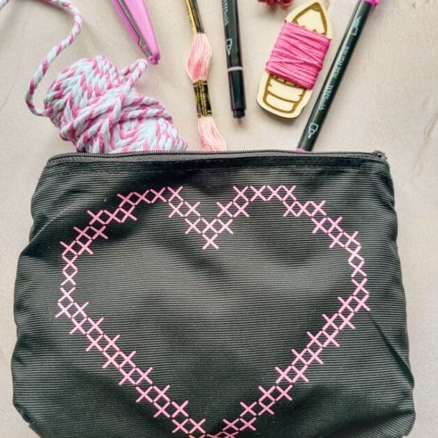 bag with cross stitch look design on front cut using a cricut machine