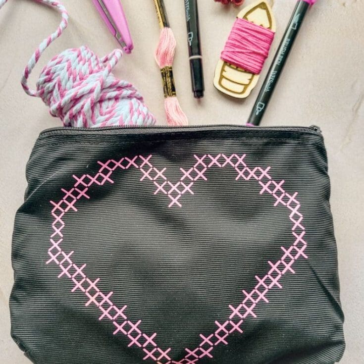 bag with cross stitch look design on front cut using a cricut machine