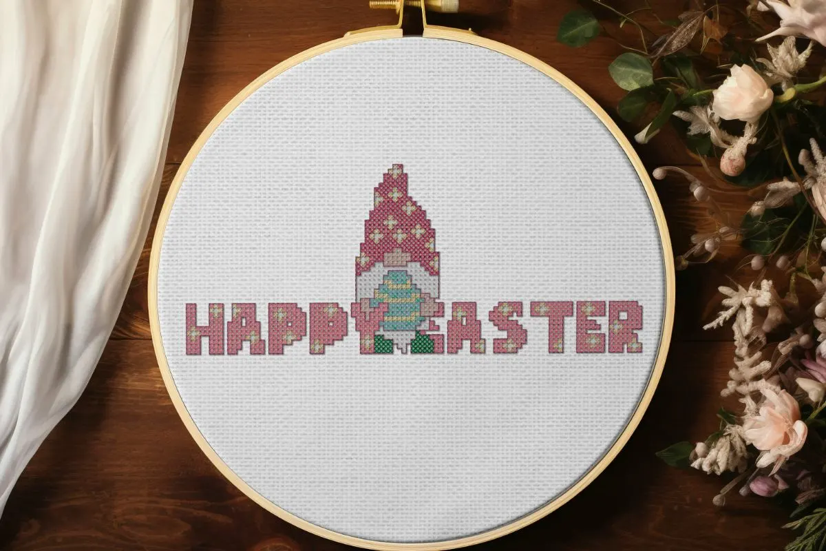 embroidered and framed in a hoop happy Easter gnome cross stitch