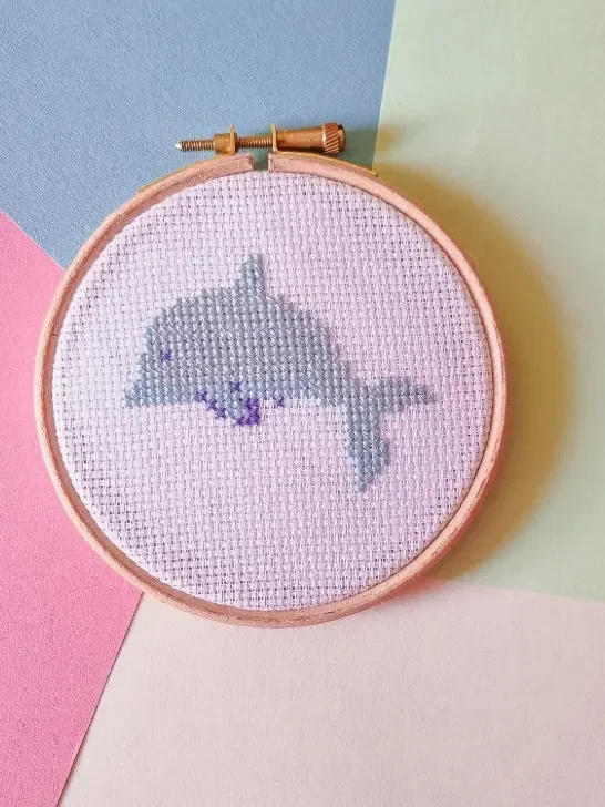 famed in a hoop embroidered tiny dolphin cross stitch pattern
