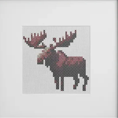 framed and embroidered moose cross stitch
