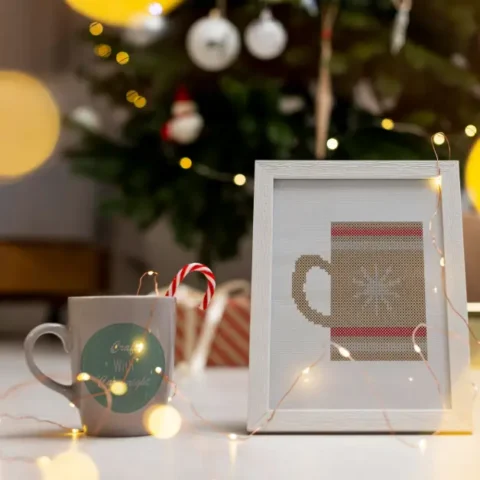 embroidered and framed cocoa mug cross stitch