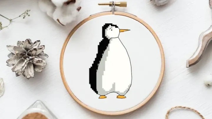 embroidered and framed in a hoop Free Penguin cross stitch pattern