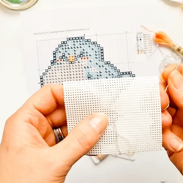 What is the loop start in cross stitch and how do you do it?